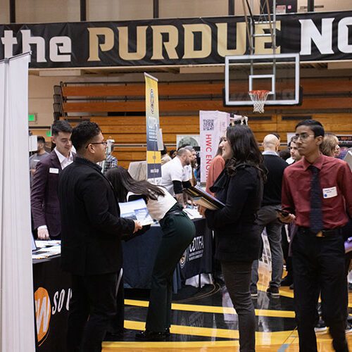 Vistors stroll through the Career Expo at Purdue University Northwest in the Fitness and Recreation Center building
