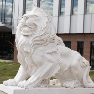 A lion sculpture outdoors on Purdue University Northwest's Hammond campus.